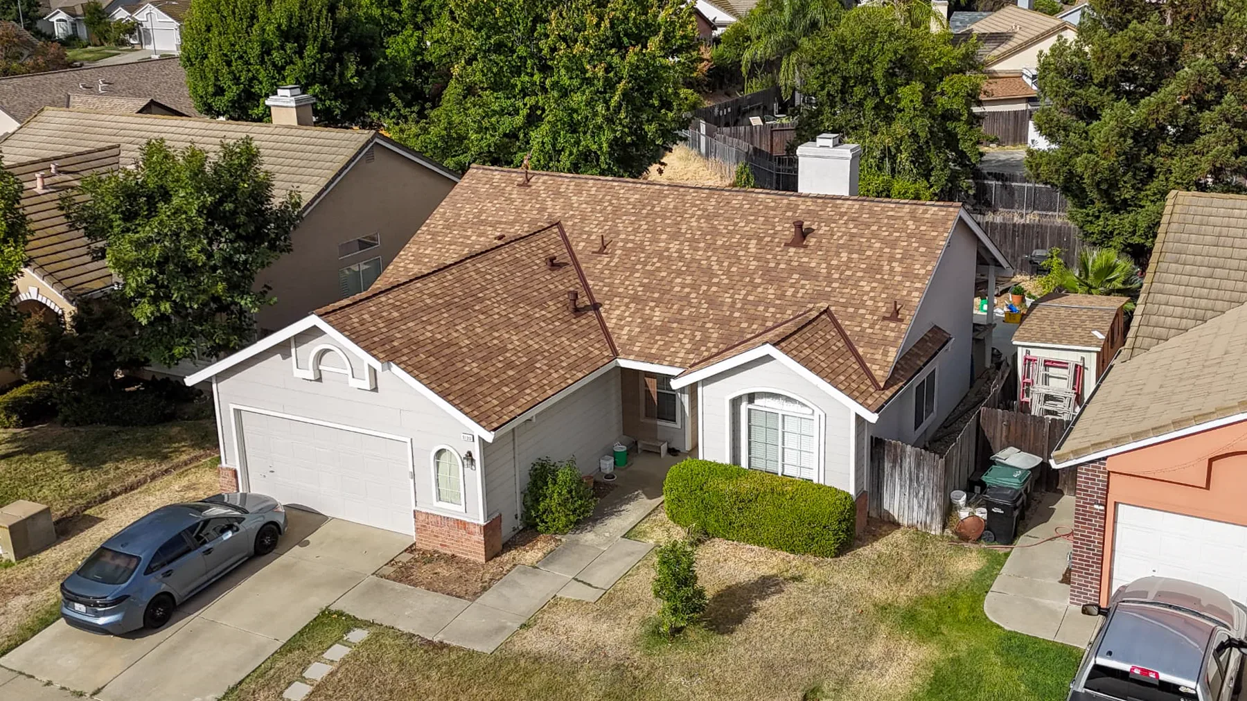 Front aerial view of a completed dimensional shingle roof replacement on a Sacramento-area home