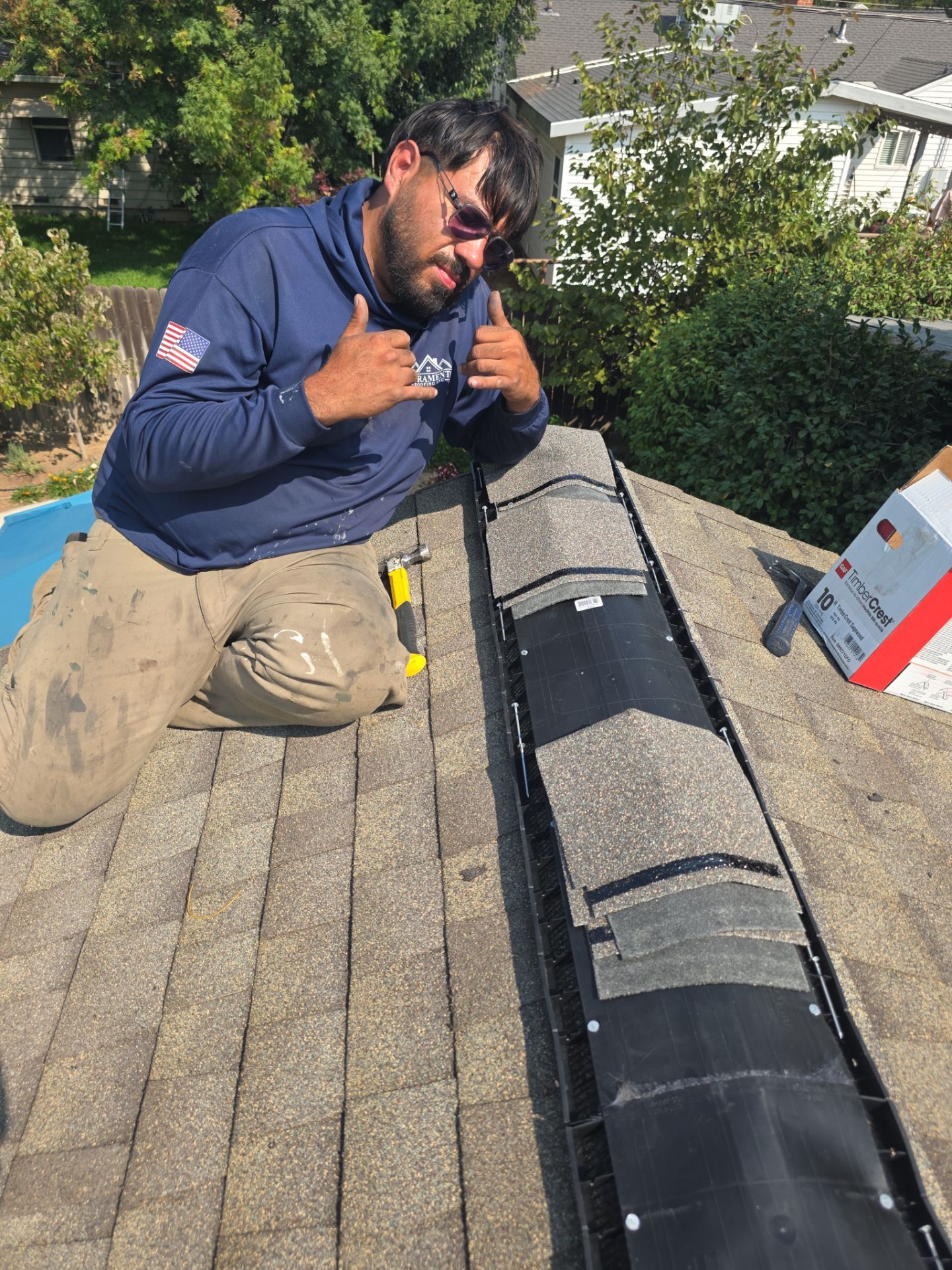 Sacramento Roofing Inc team member working on a shingle roof
